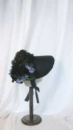Regency-Style Black Satin Bonnet with Blue Floral & Feather Embellishments – Elegant Gothic-Headpiece ARHA1008