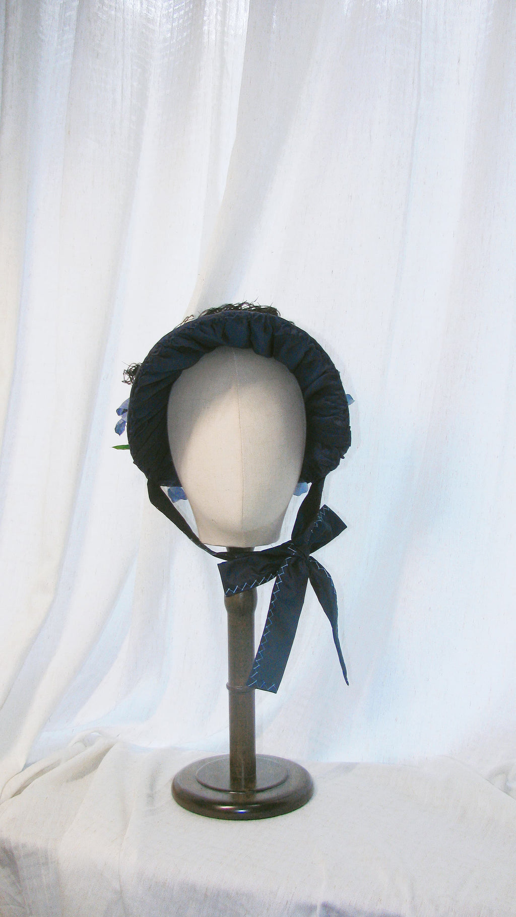 Regency-Style Black Satin Bonnet with Blue Floral & Feather Embellishments – Elegant Gothic-Headpiece ARHA1008