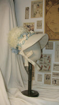 Regency Cream & Light Blue Feathered Bonnet with Floral & Satin Accents - Elegant Headwear for Tea Parties & Retro Styling ARHA1019